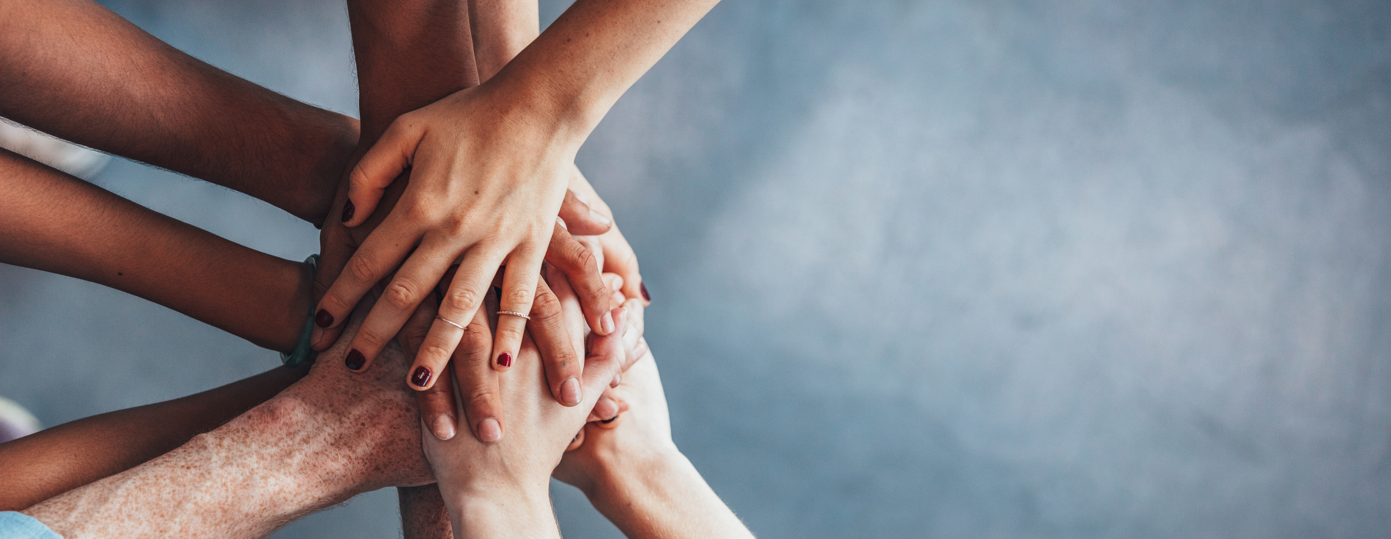 Image of hands joining in a circle