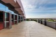 Photo of a balcony and a blue sky in background