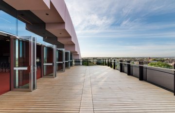 Photo of a balcony and a blue sky in background