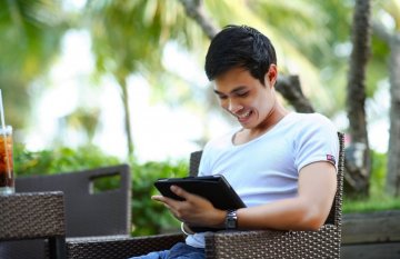 Young man looking at tablet